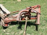 a rusted out lawn mower sitting in the grass