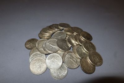 a pile of silver coins sitting on a table