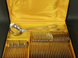 a box with a set of silverware in it on a table