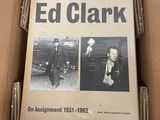 cardboard box containing a photograph of a man and a woman in a suit and tie