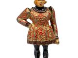 figurine of a woman in a red and gold dress and hat