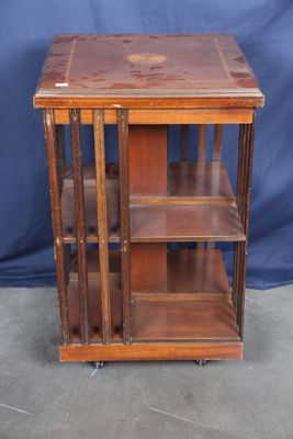 an old wooden bookcase with three shelves on top of it