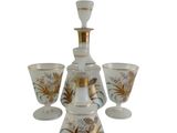 a picture of a glass decanter and four glasses