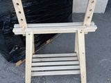 a pile of wooden furniture sitting on the ground