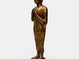 a gold statue of a person standing on top of a pedestal