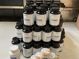 a stack of jars and containers on a table