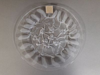 a picture of a glass bowl with spoons and forks in it