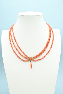 a close up of a necklace on a mannequin mannequin