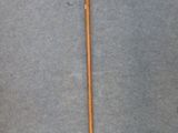 an image of a wooden stick with a metal handle