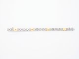 un bracelet en argent et en or muni d'un fermoir carré