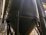 a large metal tank that is inside of a building