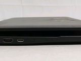 two laptops sitting side by side on a white surface