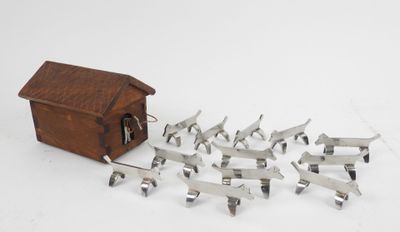 a small wooden box with a bunch of metal birds in it