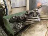 an image of a machine that is working on a piece of metal