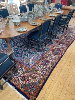 a large rug on the floor in the middle of the room