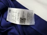 the label on a blue shirt shows the price of the item