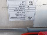 a picture of a sign on the side of a gas station