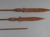 three different types of weapons are displayed on a white surface
