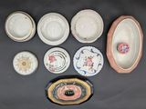 many plates and bowls that are on the table