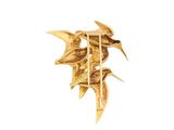 a gold brooch with birds on it on a white background