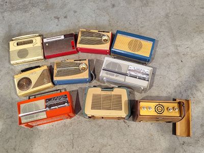 a lot of old radio ' s that are on the ground