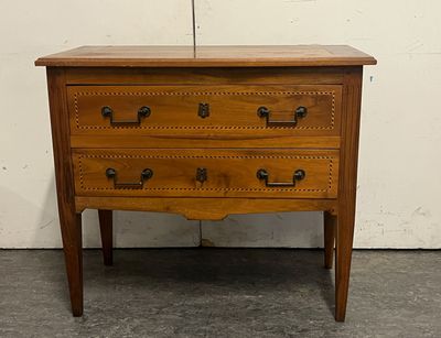 an image of a wooden chest of drawers in a room
