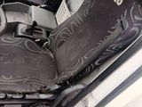a picture of a car with a seat cover and a steering wheel