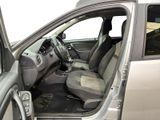 the interior of a car with the door open and the driver ' s seat down