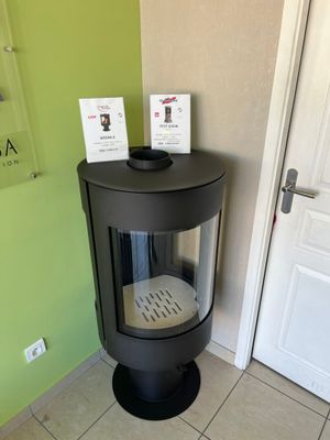an image of a corner of a room with a stove and a door