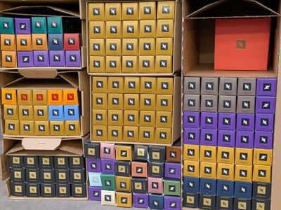 several boxes are stacked on top of each other in a room