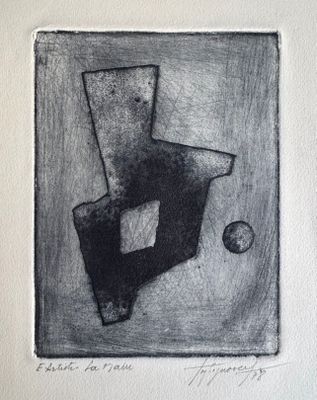 dessin en noir et blanc représentant une chaise et une balle