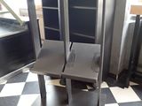 a black and white checkered floor with two chairs on it
