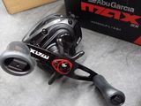 a close up of a box with a fishing reel on it