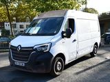 a white van that is parked on the side of the road
