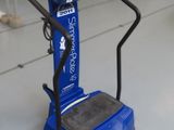 a blue machine that is sitting on the floor