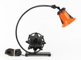 an image of a lamp with an orange shade on a white background