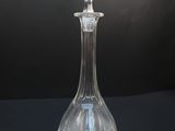 clear glass decanter on black background with black background