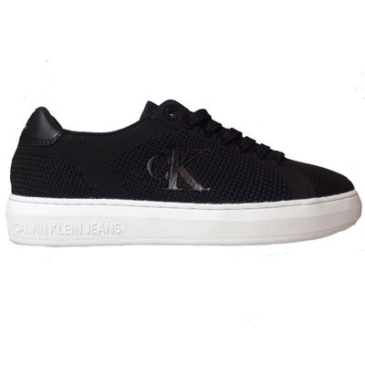men ' s black sneakers with white soles on a white background