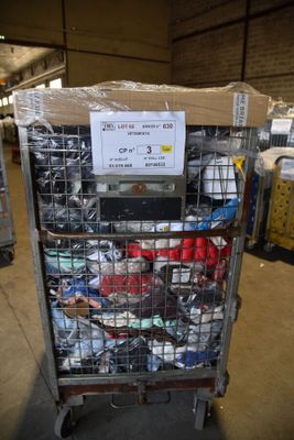 a cart with a lot of items in it in a warehouse