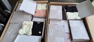 several boxes of clothing are stacked on top of each other