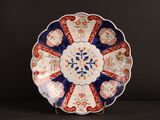 a plate that has a blue and red design on it