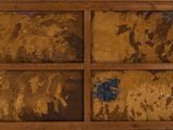 an old wooden cabinet with many different pictures on it
