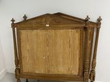 a bed with a wooden headboard and a wooden foot board