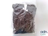 a chocolate cake in a plastic bag on a table