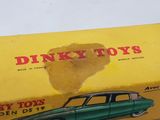 a box with a toy car in it sitting on a table