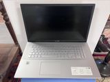 a laptop computer sitting on top of a table