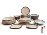 a lot of plates and bowls sitting on a table