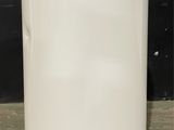 an image of a white water heater in a room
