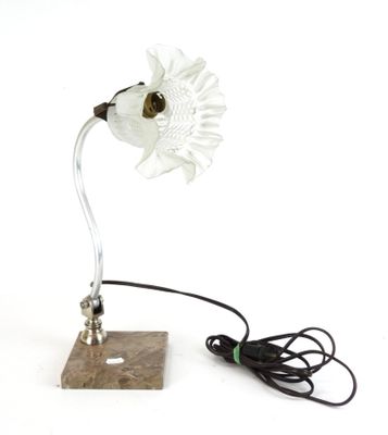a lamp that has a flower on top of it