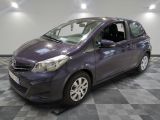 a picture of a purple toyota yaris parked in a garage